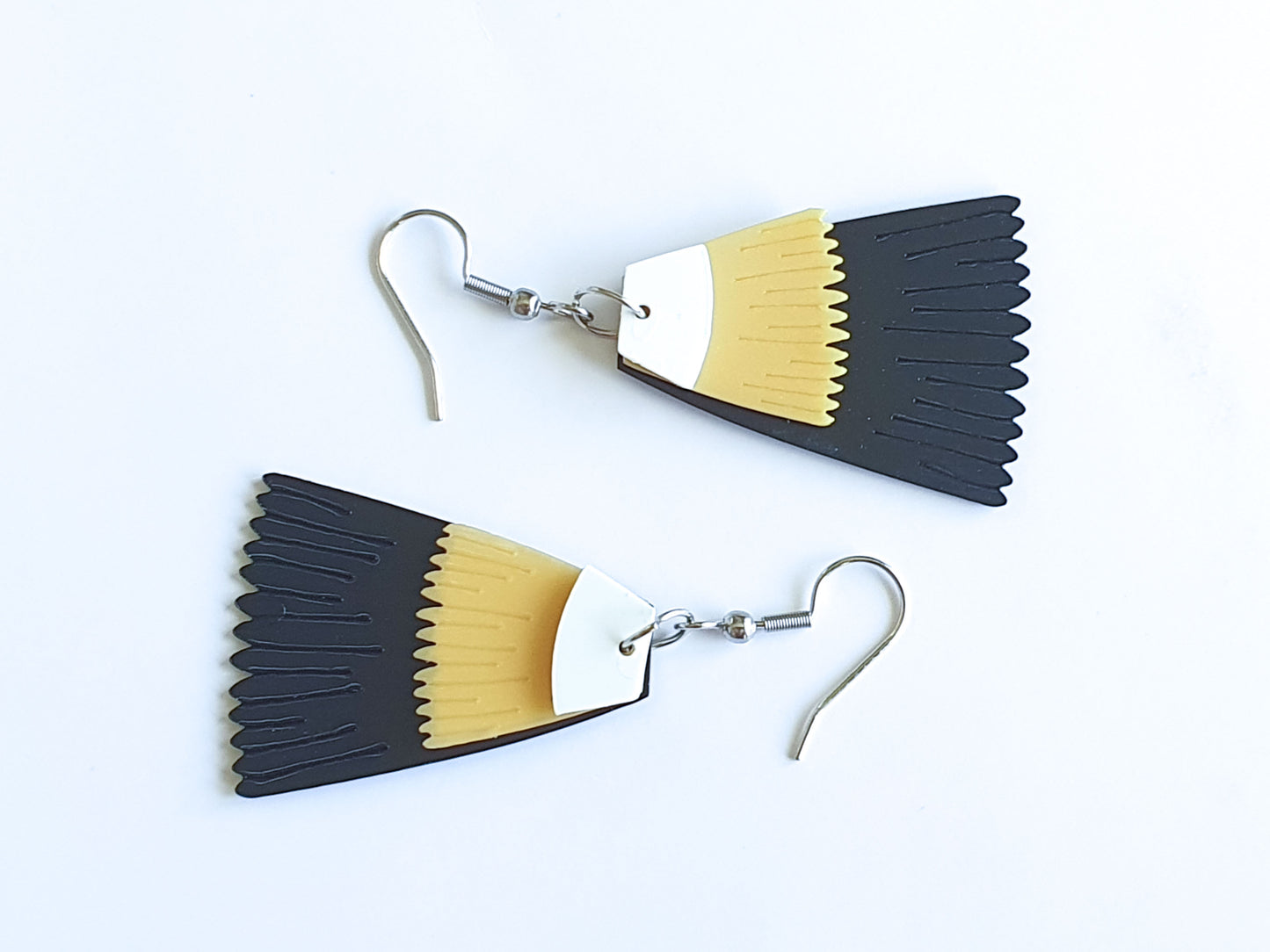 Pūteketeke Feather Earrings - BIRD OF THE CENTURY | Recycled Ice Cream Container Lids