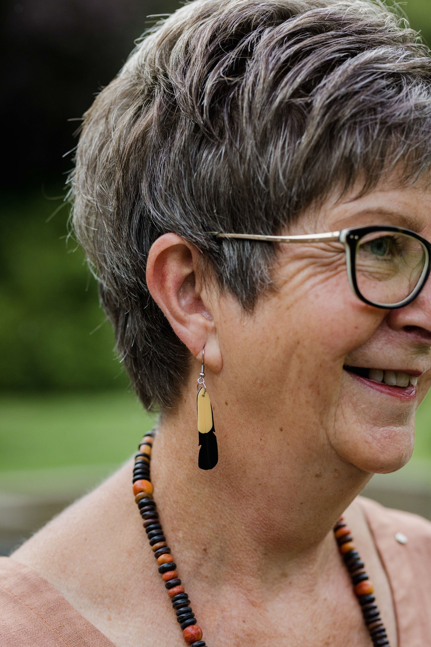 Saddleback Feather Earrings | Recycled Ice Cream Container Lids