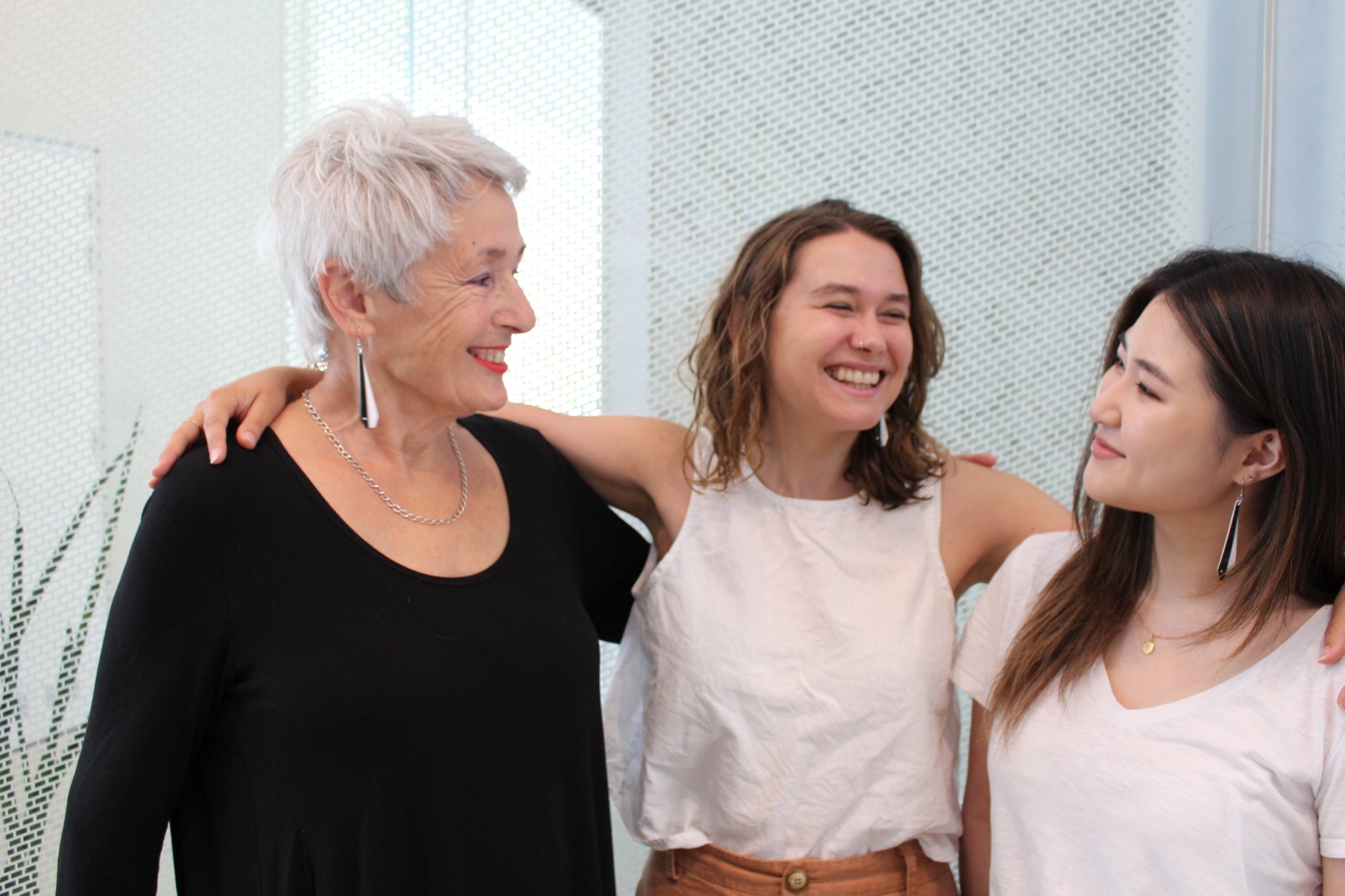Pīwakawaka Fantails recycled plastic earrings on 3 women of different ages, Made in NZ